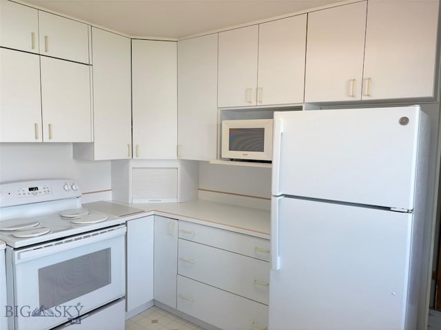 kitchen with white appliances and light countertops