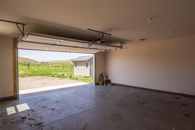 garage featuring a garage door opener and baseboards