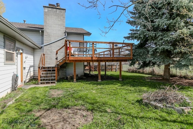 1816 S Rouse Unit 1 & 2, Bozeman, MT 59715 - rear view of house featuring stairway, a wooden deck, a yard, a chimney, and a shingled roof