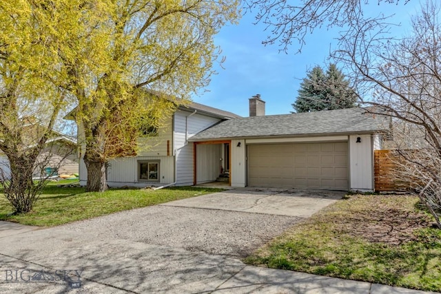 1816 S Rouse, Bozeman, MT 59715 - view of front facade with an attached garage, concrete driveway, a chimney, and a front yard