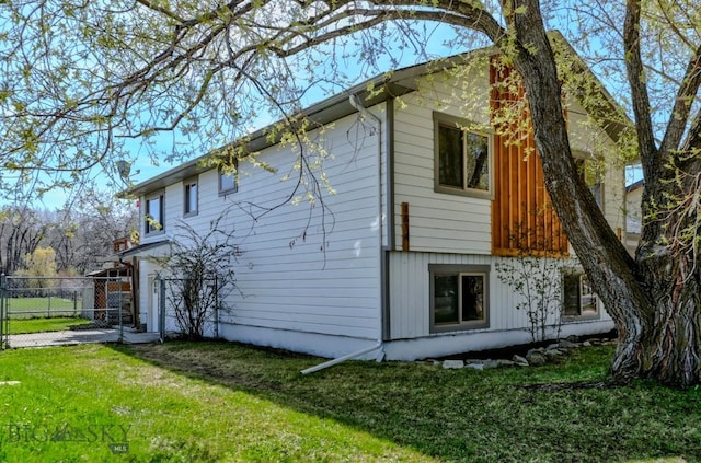 1816 S Rouse, Bozeman, MT 59715 - view of home's exterior with a garage, a gate, and driveway