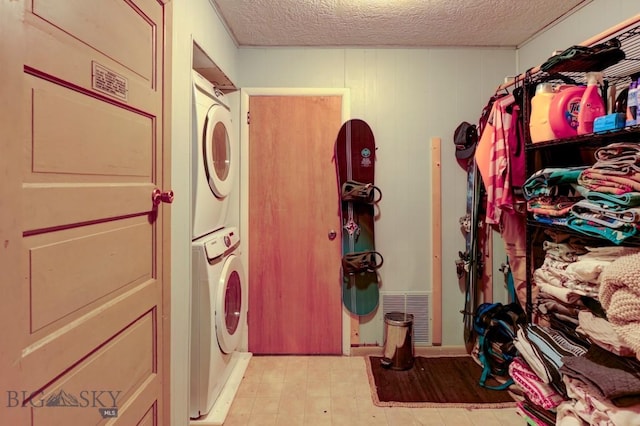 1816 S Rouse, Bozeman, MT 59715 - clothes washing area with estacked washer and dryer and a textured ceiling