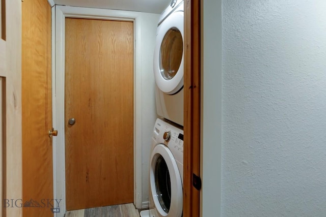 1816 S Rouse, Bozeman, MT 59715 - clothes washing area with stacked washing machine and dryer, a textured wall, and wood finished floors
