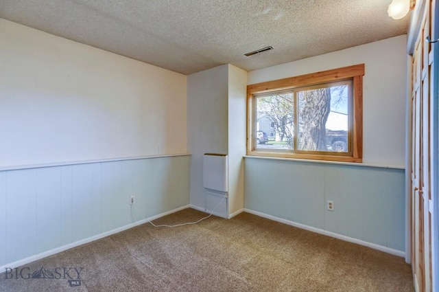 1816 S Rouse, Bozeman, MT 59715 - spare room with carpet floors, a textured ceiling, and baseboards