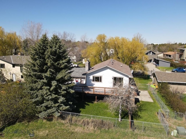 1816 S Rouse, Bozeman, MT 59715 - rear view of house featuring fence, a deck, and a chimney