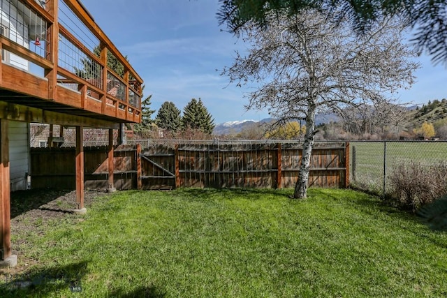 1816 S Rouse, Bozeman, MT 59715 - view of yard featuring a deck with mountain view