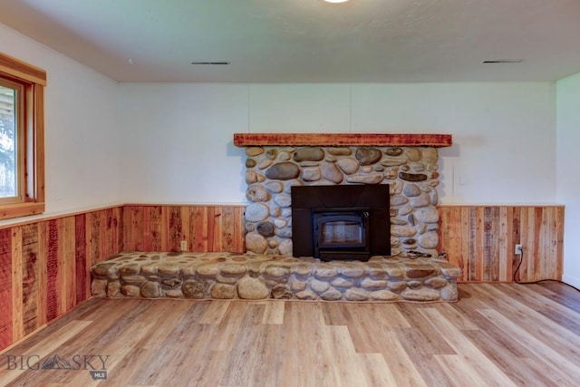 1816 S Rouse, Bozeman, MT 59715 - unfurnished living room featuring wood finished floors, a wainscoted wall, and a fireplace