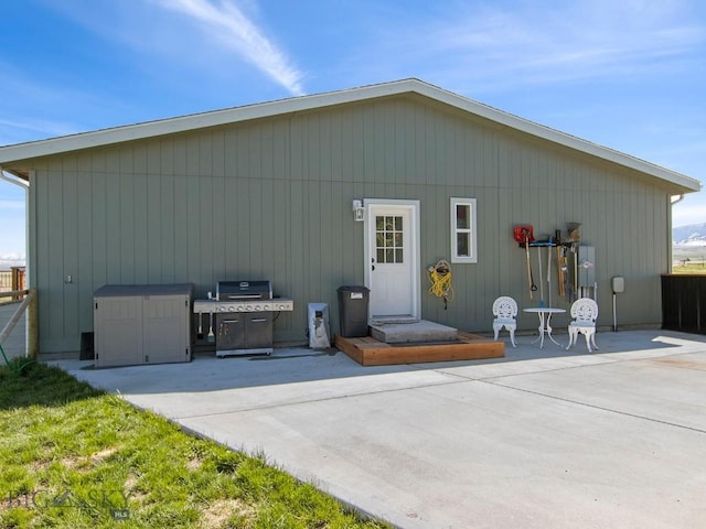 back of property with a patio