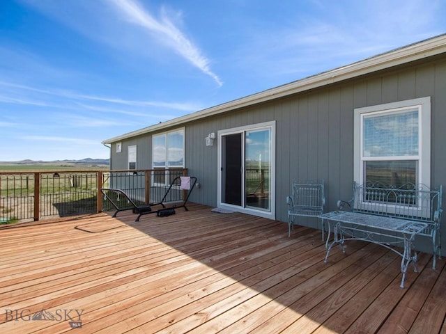 wooden terrace featuring a mountain view