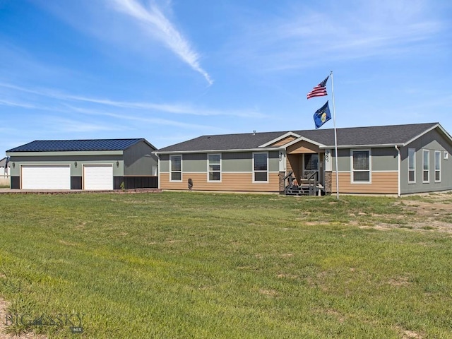ranch-style home with a front lawn and an outbuilding