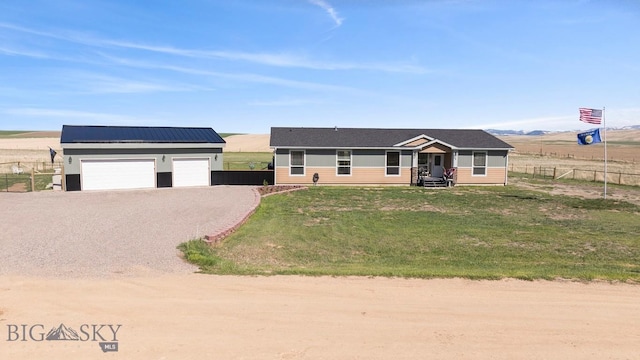single story home with an outbuilding and dirt driveway