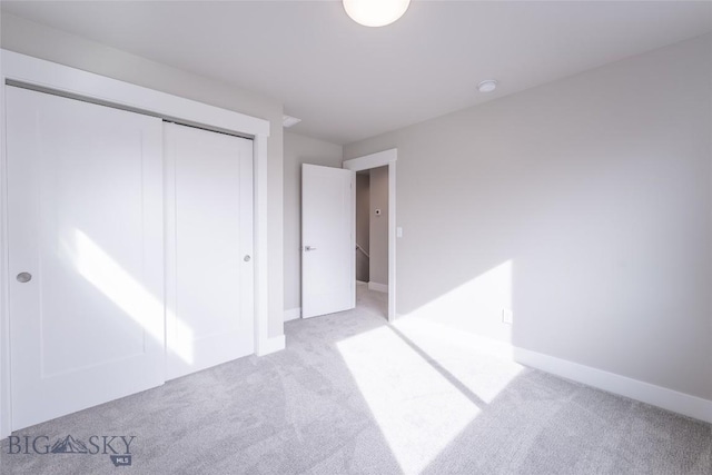 440 Meriwether Ave, Bozeman, MT 59718 - unfurnished bedroom featuring light colored carpet, a closet, and baseboards