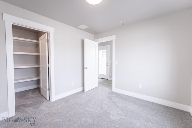 440 Meriwether Ave, Bozeman, MT 59718 - unfurnished bedroom with carpet flooring, baseboards, and a spacious closet