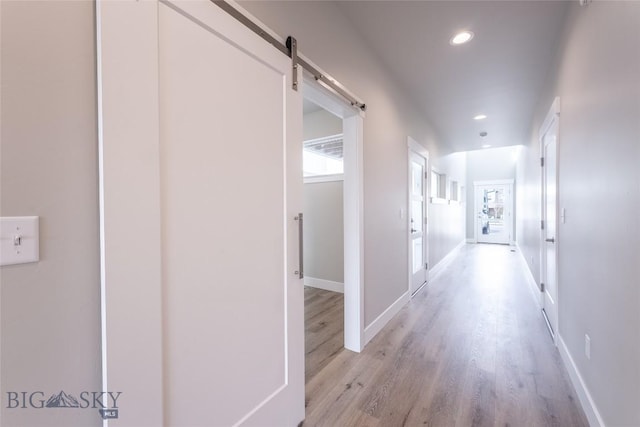 440 Meriwether Ave, Bozeman, MT 59718 - hallway with light wood-style flooring, recessed lighting, a barn door, and baseboards