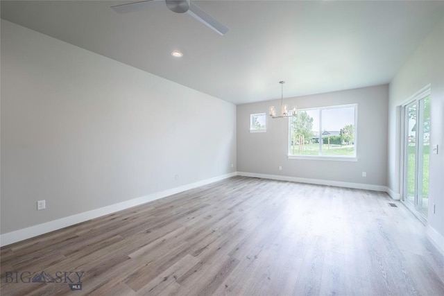 440 Meriwether Ave, Bozeman, MT 59718 - empty room featuring healthy amount of natural light, wood finished floors, a chandelier, and ceiling fan