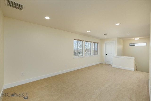 342 Parklands Trl, Bozeman, MT 59718 - spare room featuring light carpet, recessed lighting, and baseboards