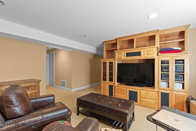 living room featuring light colored carpet, recessed lighting, and baseboards