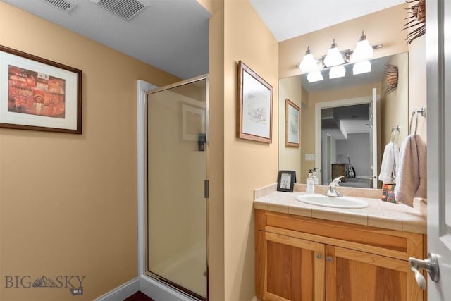 full bathroom with a stall shower, vanity, and ensuite bath