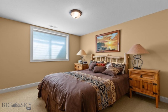 carpeted bedroom featuring baseboards