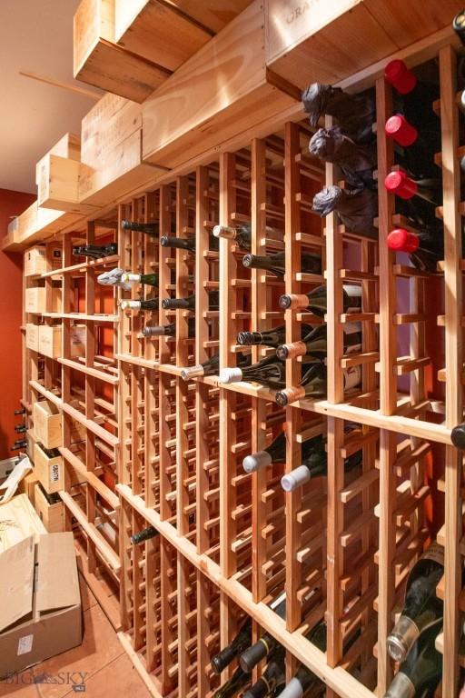wine area featuring tile patterned floors