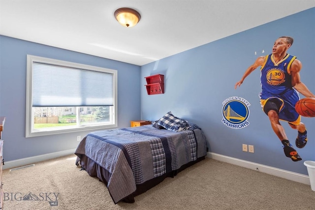 bedroom with carpet and baseboards
