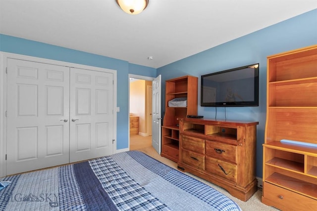 bedroom featuring a closet, carpet floors, and baseboards
