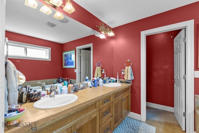 full bathroom featuring double vanity and tile patterned floors