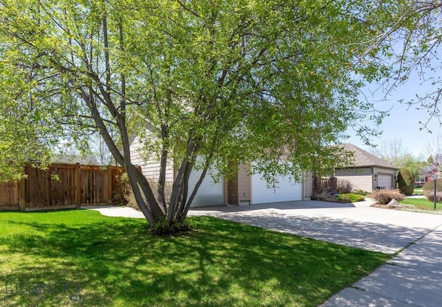 obstructed view of property with an attached garage and driveway