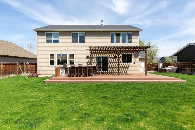 rear view of house featuring a pergola and a deck