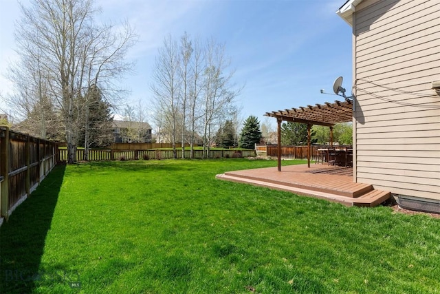 view of yard with a deck and a pergola