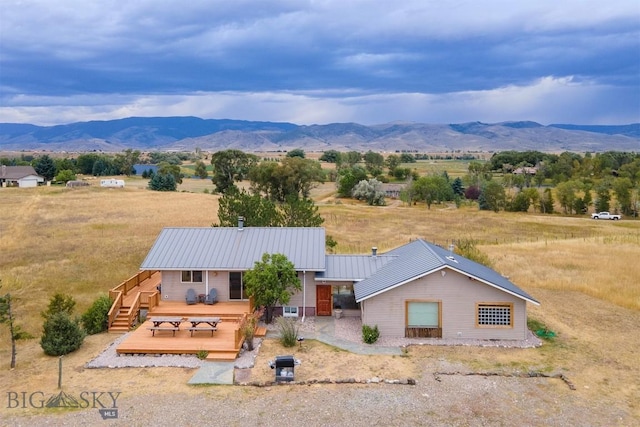 28 Loch Leven Rd, Livingston, MT 59047 - view of front of property with a deck with mountain view, a rural view, and metal roof
