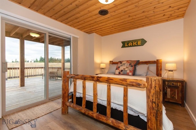 28 Loch Leven Rd, Livingston, MT 59047 - bedroom with wood finished floors, access to exterior, wooden ceiling, and baseboards