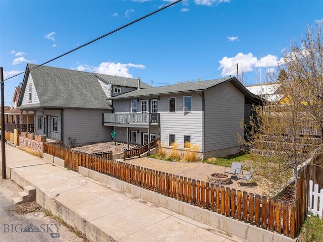 517 W Daly, Walkerville, MT 59701 - rear view of property with a fire pit, a balcony, and a patio