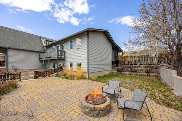 517 W Daly, Walkerville, MT 59701 - view of patio with an outdoor fire pit, a balcony, and fence