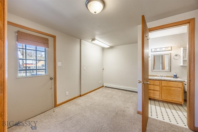 517 W Daly, Walkerville, MT 59701 - basement with baseboard heating, a sink, light carpet, and baseboards