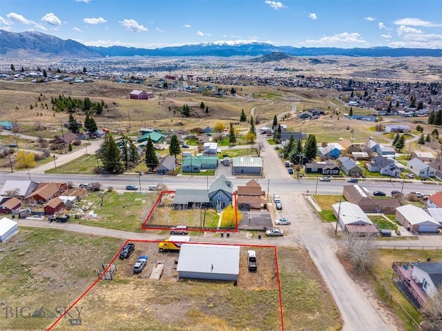517 W Daly, Walkerville, MT 59701 - aerial view of residential area with property boundaries highlighted and a mountainous background