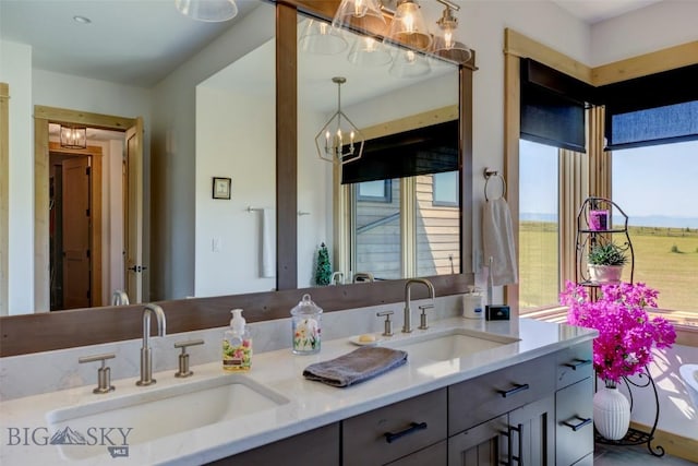 419 Upper Autumn Ridge Rd, Bozeman, MT 59715 - bathroom featuring a chandelier and double vanity