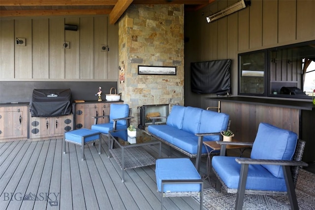 419 Upper Autumn Ridge Rd, Bozeman, MT 59715 - deck with area for grilling and an outdoor living space with a fireplace