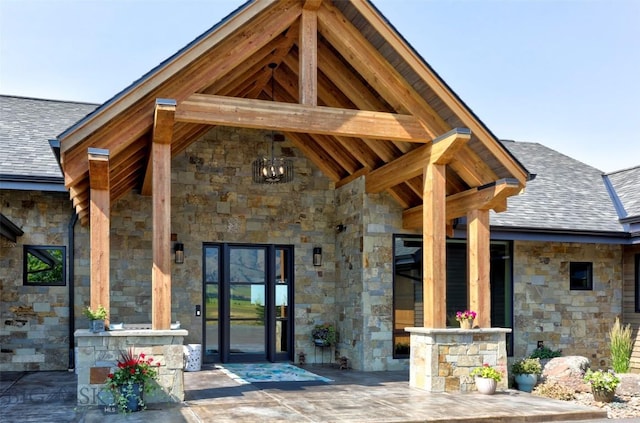 419 Upper Autumn Ridge Rd, Bozeman, MT 59715 - entrance to property featuring stone siding and a shingled roof