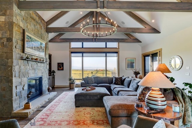 419 Upper Autumn Ridge Rd, Bozeman, MT 59715 - living room featuring beam ceiling, high vaulted ceiling, a stone fireplace, a chandelier, and wood finished floors