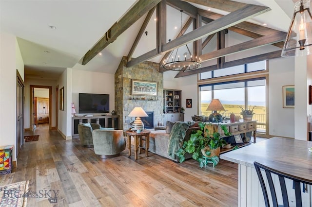 419 Upper Autumn Ridge Rd, Bozeman, MT 59715 - living room featuring high vaulted ceiling, beamed ceiling, wood finished floors, a chandelier, and recessed lighting