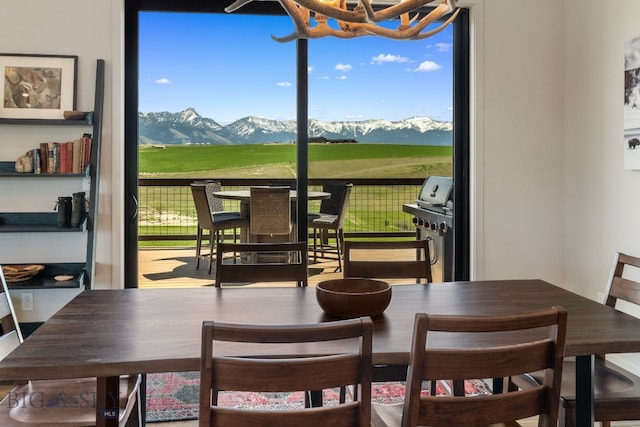 20 Prairie Falcon Ln, Belgrade, MT 59714 - dining space featuring a chandelier and a mountain view