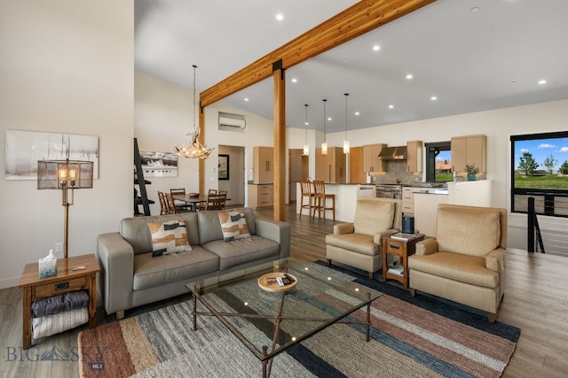 20 Prairie Falcon Ln, Belgrade, MT 59714 - living room featuring light wood-style flooring, a wall unit AC, beamed ceiling, a chandelier, and recessed lighting
