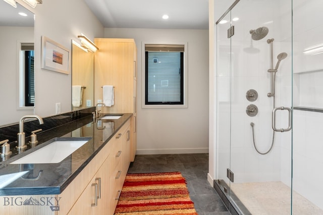 20 Prairie Falcon Ln, Belgrade, MT 59714 - bathroom featuring a shower stall, recessed lighting, double vanity, and baseboards