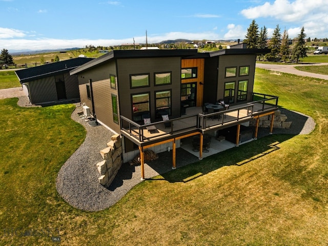 20 Prairie Falcon Ln, Belgrade, MT 59714 - back of house featuring a yard and a deck with mountain view