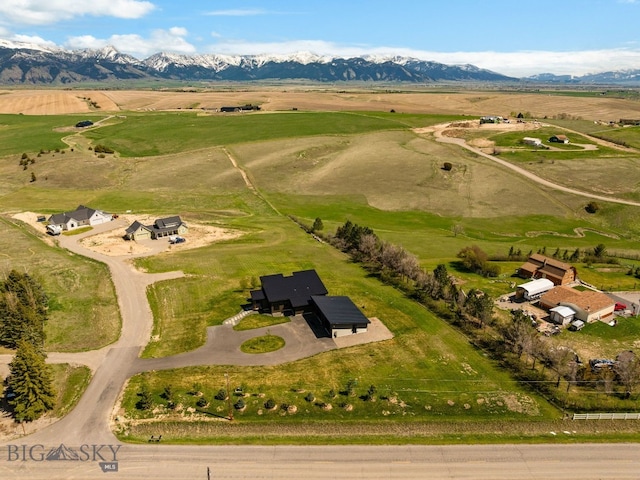 20 Prairie Falcon Ln, Belgrade, MT 59714 - aerial overview of property's location with a mountainous background and rural landscape