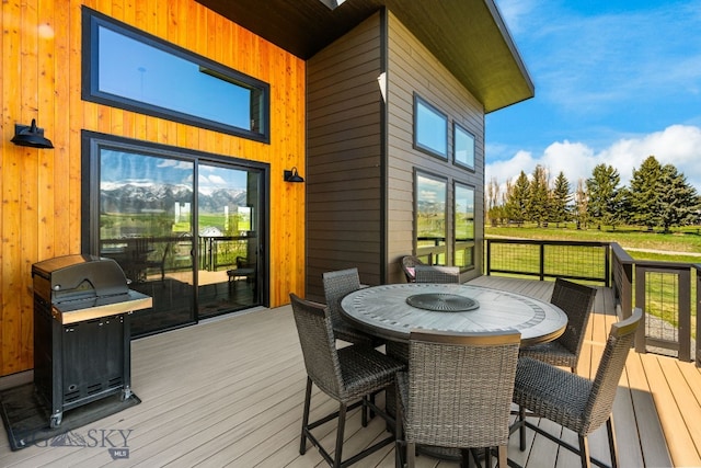 20 Prairie Falcon Ln, Belgrade, MT 59714 - wooden terrace with outdoor dining space and grilling area