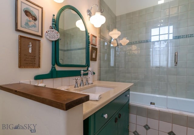 full bathroom with vanity and tiled shower / bath combo