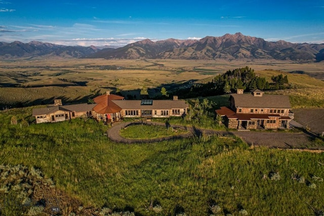 aerial view of property and surrounding area with a mountainous background