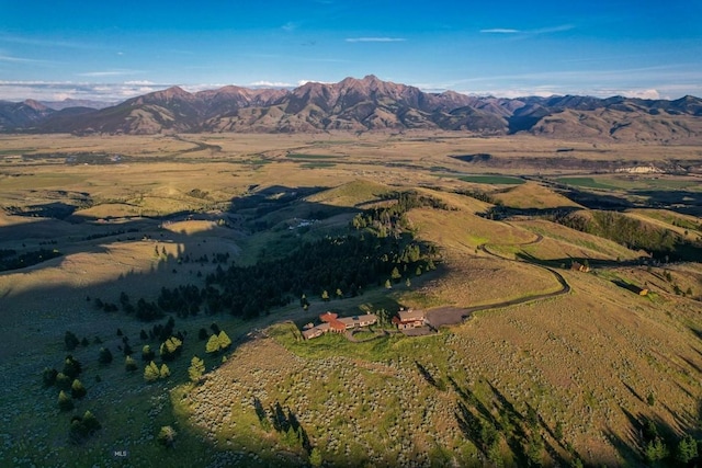 aerial view of property and surrounding area with a mountainous background